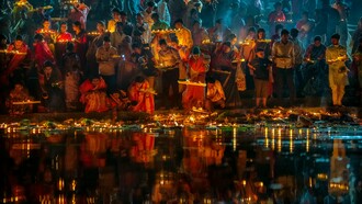 Devotees releasing glowing plates of offerings into the Ganges at night, reflecting a timeless act of faith and reverence