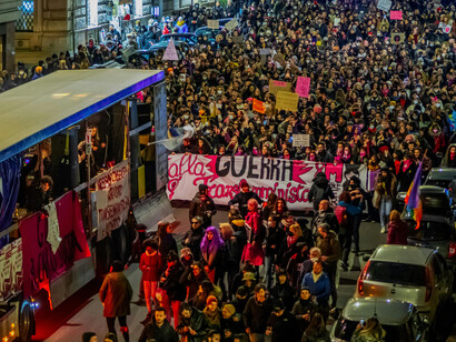 People gather and march through the city center during a lively nighttime protest in Rome, Italy