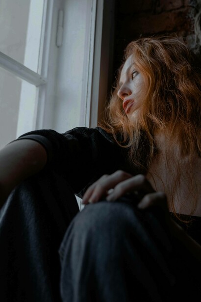 Gazing out the window, hopelessly