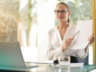 An employee working with sustained focus and positivity, reflecting how resilience is built through shared success