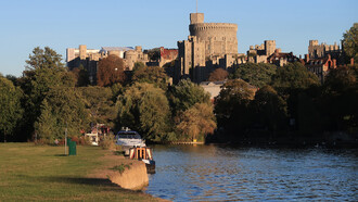 Windsor Castle viewed across the River Thames, reflecting England’s historic royal landscape, UK
