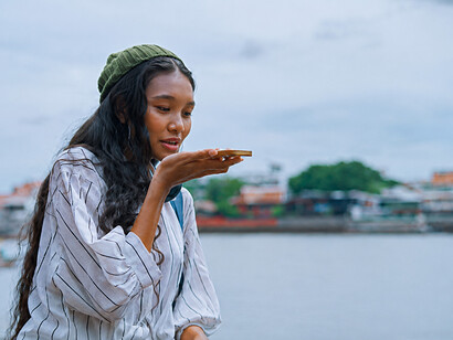 Woman using an AI chatbot application on her smartphone