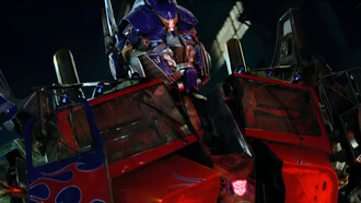 Optimus Prime revealing his imposing robotic form to Sam Witwicky, representing the larger-than-life spectacle and tactile detail of Transformers (2007)