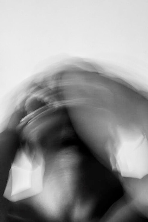 Blurred man shaking his head, crying at the society that alienates him