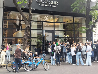 Group of fans gathered in front of the Hotel "Casa Sur", where Liam Payne passed away, placing floral offerings and photos of him. Palermo neighborhood, Buenos Aires, Argentina