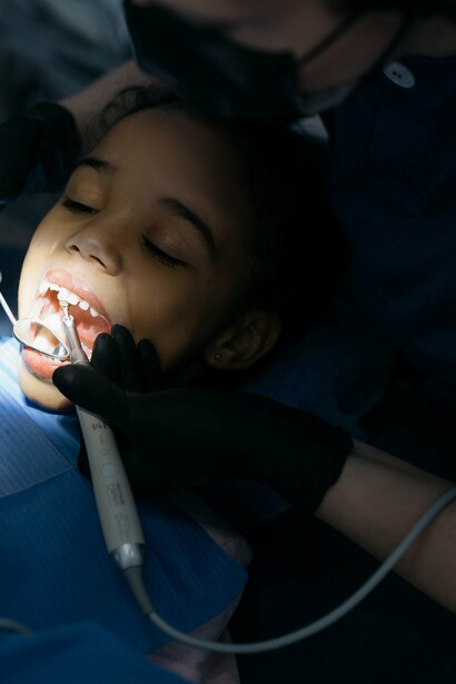 Young girl is patient during dental exam