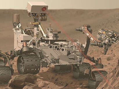 This depicts the rover Curiosity, of NASA's Mars Science Laboratory mission, as it uses its Chemistry and Camera (ChemCam) instrument to investigate the composition of a rock surface