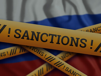 Striking visual: yellow tape marked with sanctions sign, a potent symbol of imposed sanctions on Russia