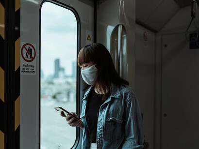 The woman finds solace and inspiration, she travels not just to her destination but through the memories of journeys past, fuelling her spirit with the desire to explore the world anew
