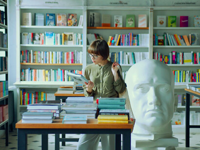 Surrounded by shelves of wisdom, she understands that each book holds the potential to unlock a deeper understanding of the world