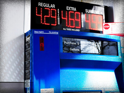 A blue gas pump with a digital clock on top of it