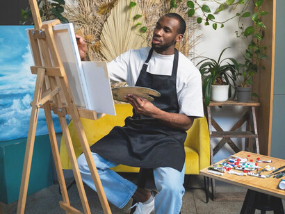 As the artist carefully applies each stroke, AI tools silently work in the background, analyzing trends and offering insights that help inform the creative direction of her work