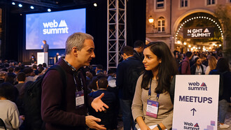 Attendees network during Web Summit in Lisbon, where talks, meetups, and the Night Summit bring together global leaders, innovators, and entrepreneurs