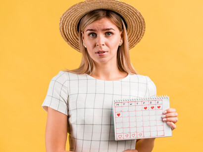 Colorful menstrual calendar with heart designs, representing the emotional and physical aspects of women's health