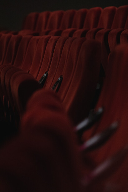 Cinema experience with our stylish scarlet fabric-upholstered padded chairs, designed for ultimate comfort and luxury