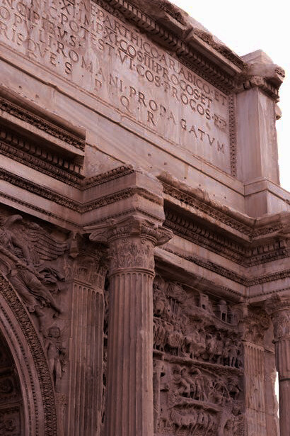 The magnificent detail of the Arch of Septimius Severus, a white marble triumphal arch at the northwestern end of the Roman Forum in Rome, Italy, dedicated in 203 AD, is a testament to the incredible skill and dedication of ancient Roman craftsmen