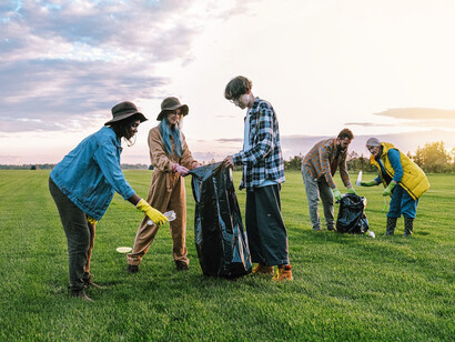 A group of dedicated volunteers gathers in the field, ready to make a positive impact on the environment through their collective efforts