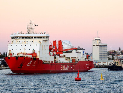 Xue Long, a Chinese icebreaker, departing from the inner harbour of the Port of Fremantle, Western Australia, on her way back to her port of registry, Shanghai, China