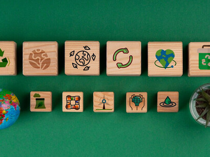 Wooden cubes display the sustainable development goals, representing a strong commitment to advancing environmental and social progress