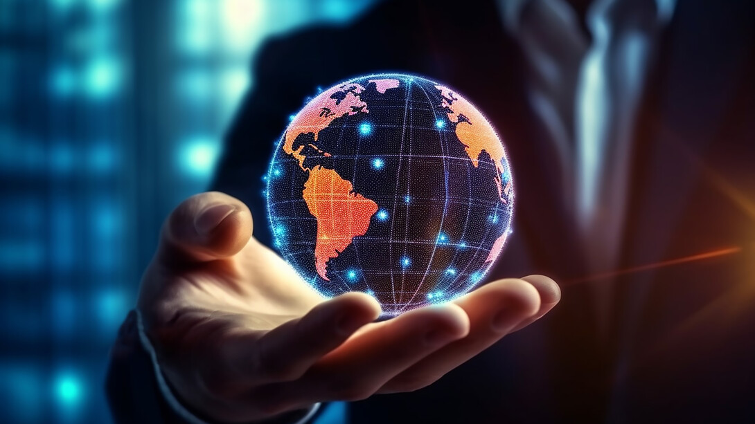 A man holding the world in his hand symbolizes how multinational corporations influence global business, economic growth, and international trade through strategic investment and technological innovation