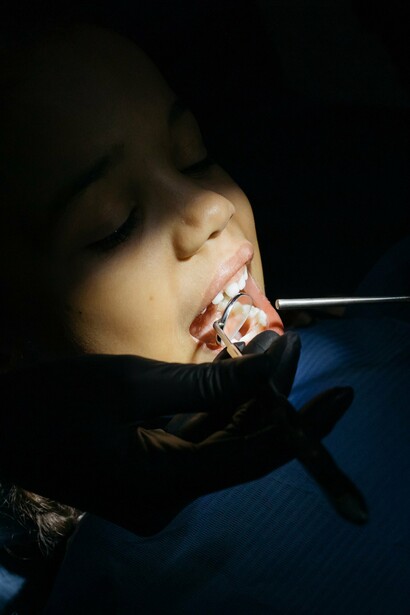 Young girl is relaxed while having her dental exam