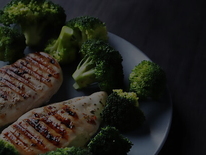 Succulent grilled chicken breast served with a side of vibrant broccoli