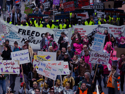Demonstrators unite in Hamburg, Germany, advocating for compassion and solidarity with migrants facing displacement from conflict zones