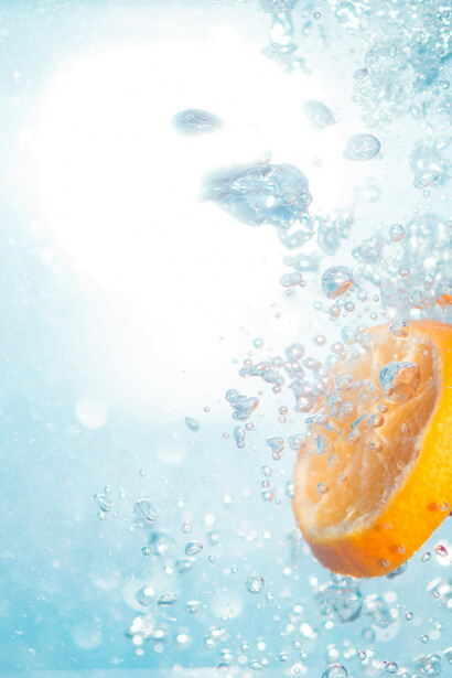 Water infused with fresh citrus fruits; even when genetic markers suggest certain intolerances, the gut microbiome can play a pivotal role in mitigating these issues