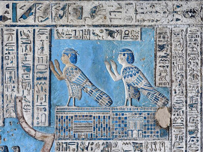 A detailed perspective of the artistry adorning the ceilings and murals within the Dendera Temple of Hathor, a revered sanctuary devoted to the goddess Hathor, nestled in Dendera, Egypt, the intricate display highlighting the mesmerising allure of Egyptian blue pigment