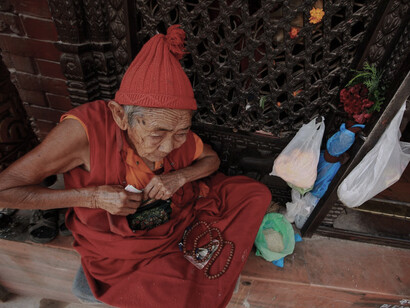 Elderly monk by temple