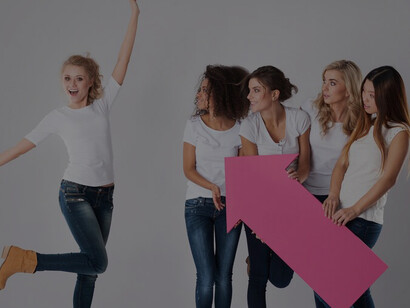 Women rallying around and supporting a young woman, showcasing empowerment and encouragement for girls