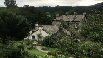 The rear view of Dove Cottage in Grasmere, Cumbria, UK, the former home of poet William Wordsworth and a central landmark of the Romantic literary movement