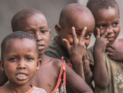 Amidst the challenges faced by modern South Africa, children gather in the streets, embodying the aspirations of millions for a better tomorrow, where opportunities abound and hardships are overcome through unity and determination