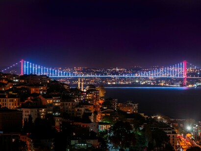 The illuminated Bosphorus Bridge at night in Istanbul, Turkey
