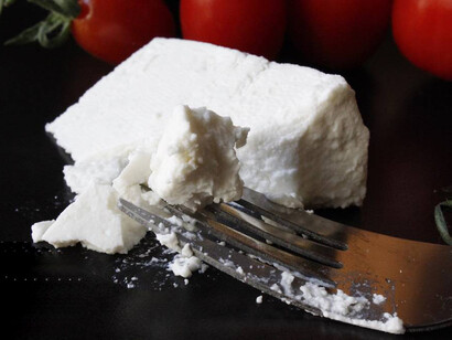 Imagining how it must be written in order to produce the sound "ricotta" becomes "rigawt"