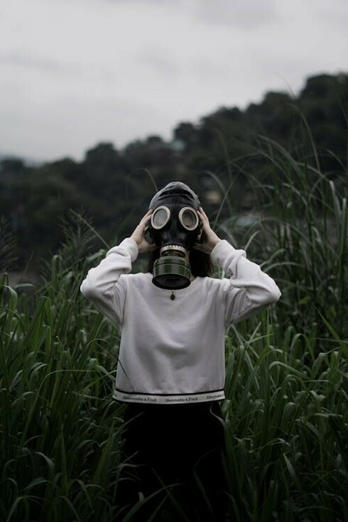 A person in a gas mask, symbolizing the need for protection in hazardous situations