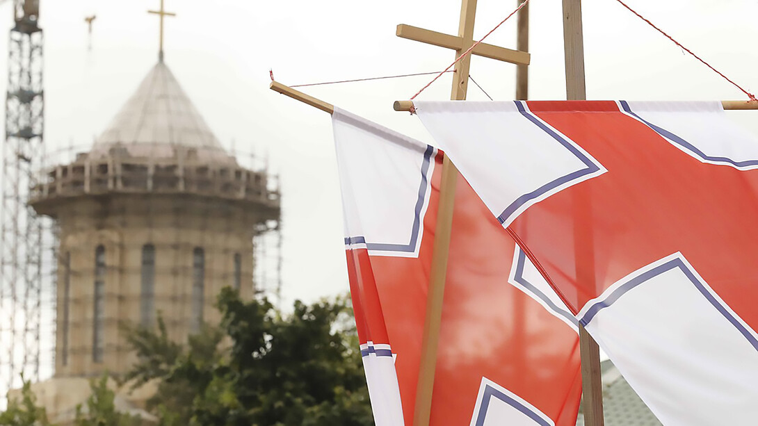Standards of the Georgian Orthodox Church flying by the Cathedral of the Holy Mother of Iberia in Zugdidi, Georgia, during the 2020 Vlakernoba procession, Georgia