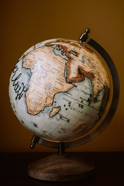 Photograph a desk globe featuring a brown and white color scheme