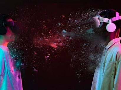 A young couple immersed in a virtual reality experience, both wearing VR glasses