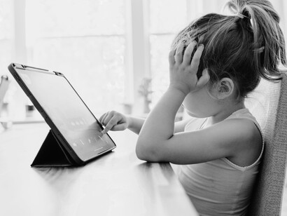 A young girl does educational games online