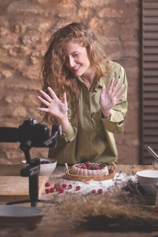 An engaging food influencer capturing a delectable dessert, showcasing culinary trends through vibrant social media food blogging