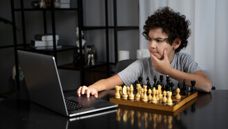 Pensive, a young chess player competes against a chess software
