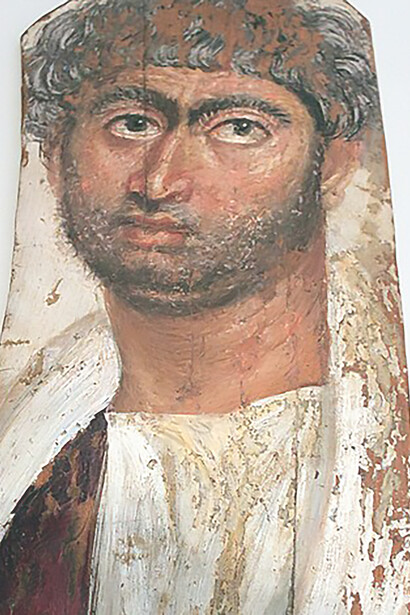 The striking Mummy Portrait of a Bearded Man exhibited at the Altes Museum in Berlin, revealing the artistry of ancient Egyptian burial customs