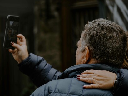 A couple stopped to take a selfie and to no doubt post it later on their multiple social media platforms