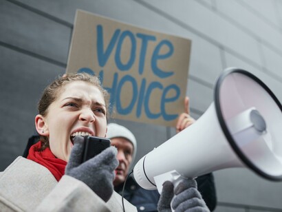 An enthusiastic young woman at a rally