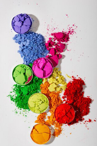 Colorful eyeshadow palette captured from above on a clean white background