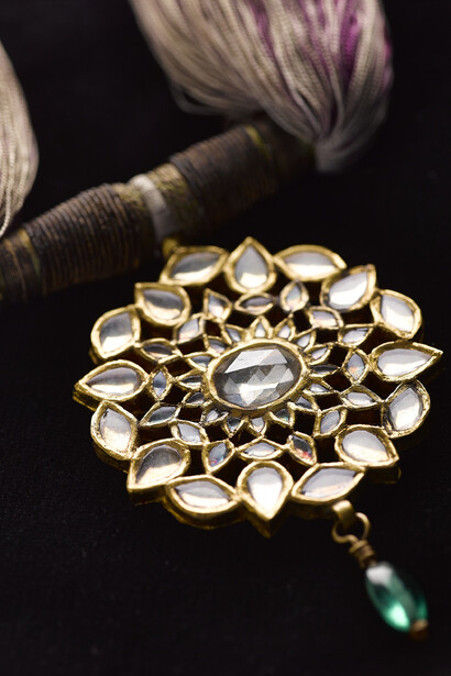Necklace of rock crystal with a green glass bead and silk threads, Northern India, 19th century © National Museums Scotland