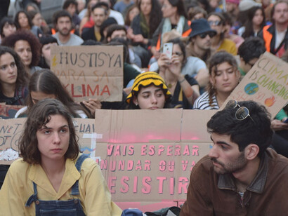 Protesters express their frustration with the global economic system, highlighting the urgent need for reform in areas like trade, debt, and climate policy to create a more equitable world