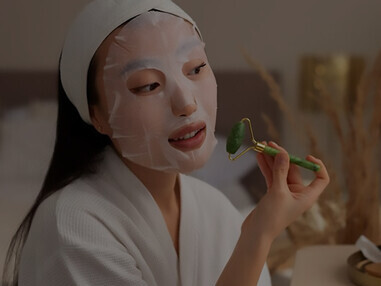 Unveil the secrets of effective skincare routines with a woman indulging in her skincare essentials, including the application of a nourishing face mask