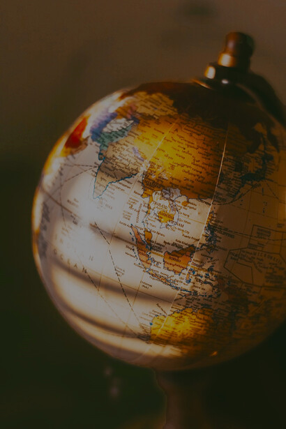 Desk globe with a color palette that combines shades of brown and white